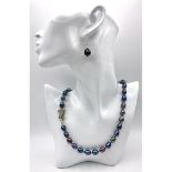 A top quality, metallic grey, natural, Tahitian pearls necklace with a panther clasp adored with