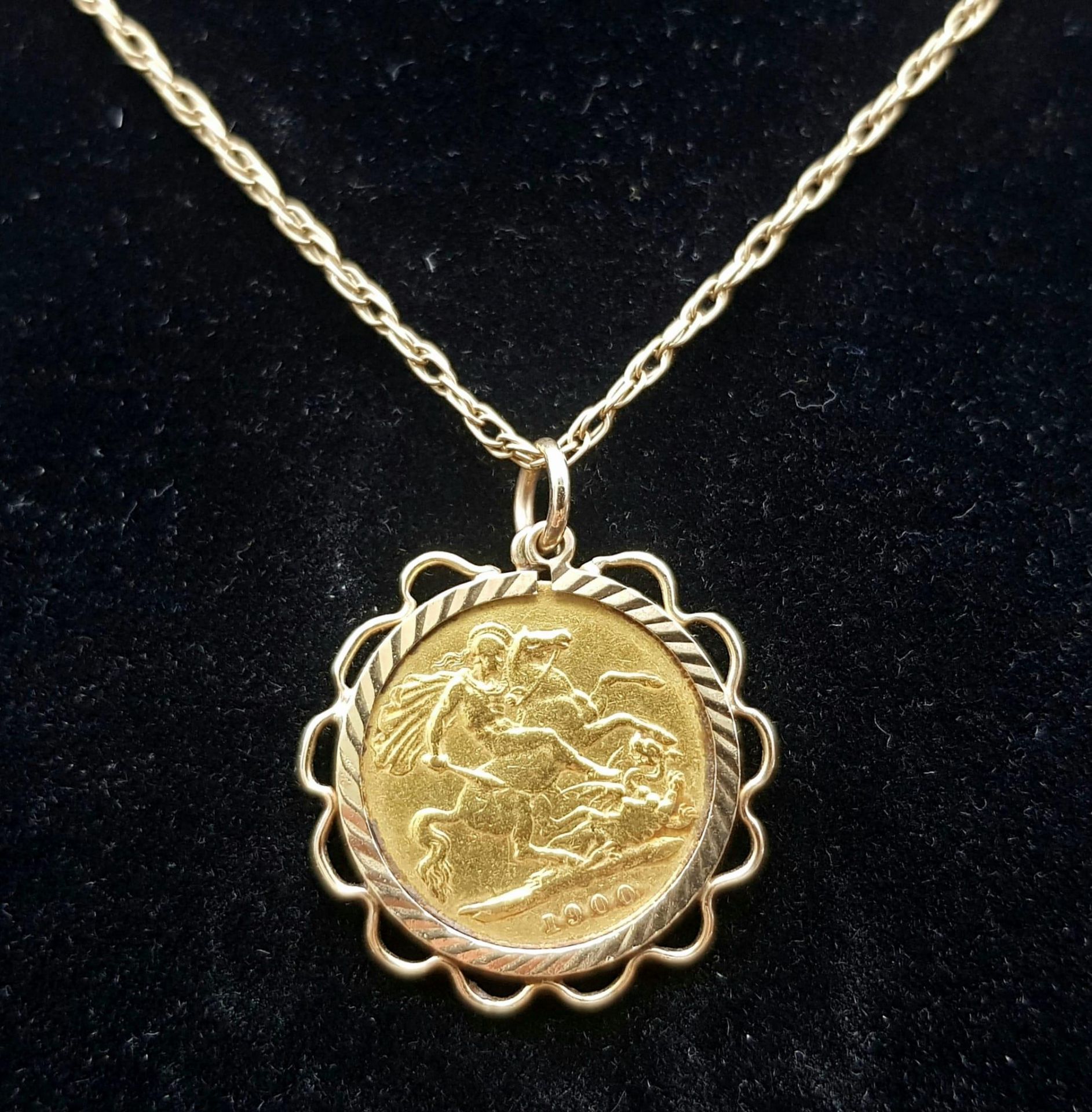 A 1900 22k Gold Queen Victoria Half Sovereign set in a 9K Gold Casing on a 9K Yellow Gold Chain -