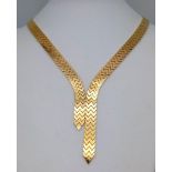 An Elegant 18K Gold Flat Scale Link Necklace with Twin Tassel Extenders. 48cm length. 35.25g weight.