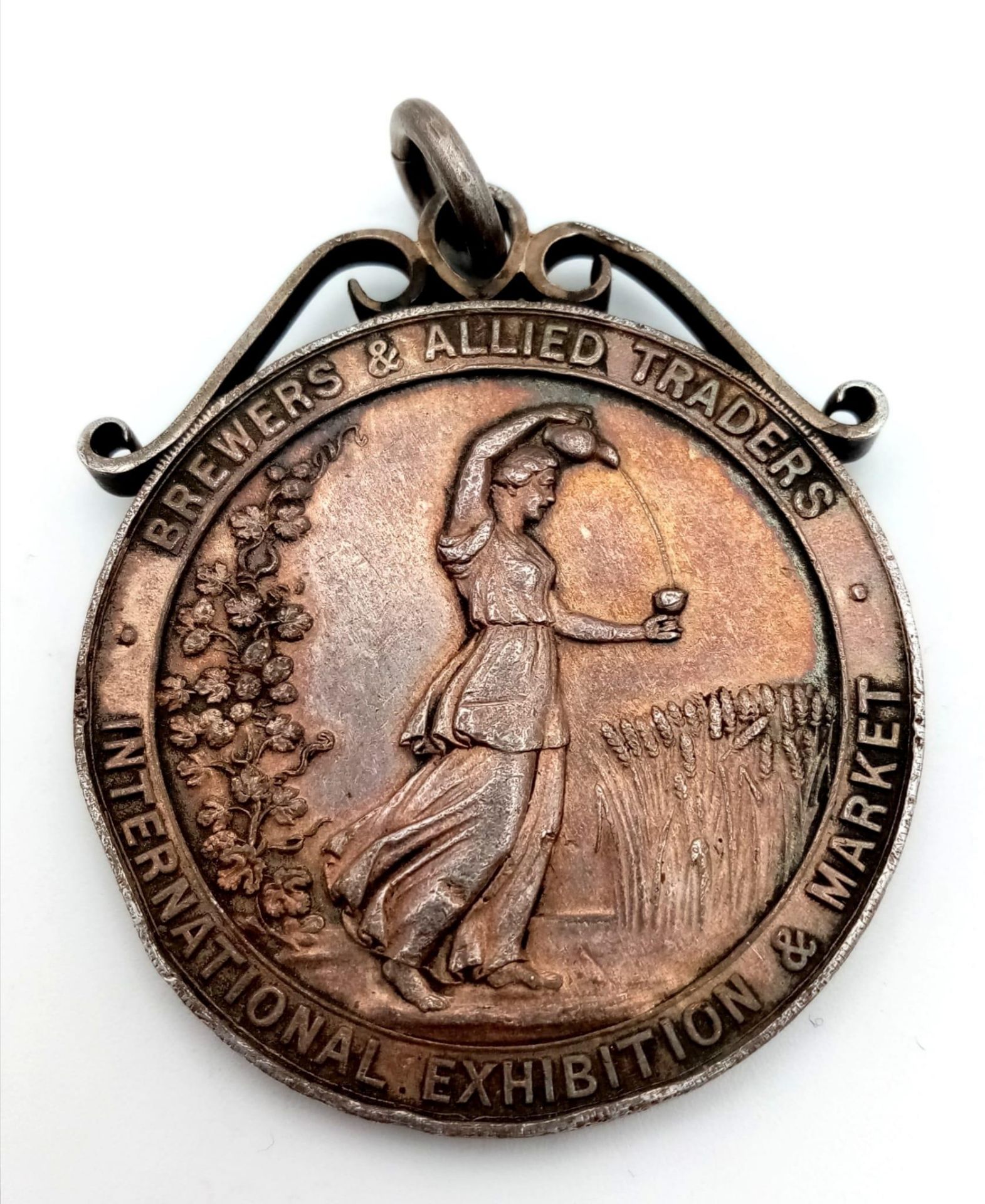 An Antique 1st prize sterling silver medal dated 1928 in the beer competition awarded to T.Losco