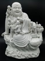 A Wonderful Large Chinese Blanc de Chine Budai - Laughing Budai seated with 5 small Children -