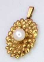 A 9K yellow gold unusual oval pendant set with a white 6mm cultured pearl, 5.7g 26mm x 14mm ref: