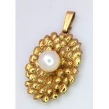 A 9K yellow gold unusual oval pendant set with a white 6mm cultured pearl, 5.7g 26mm x 14mm ref:
