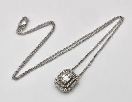 A 18K WHITE GOLD 0.60CT DIAMOND SET PENDANT ON CHAIN. TOTAL WEIGHT 3.7G