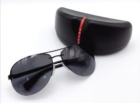 A PAIR OF "PRADA"AVIATOR SYLE SUNGLASSES IN THE ORIGINAL CASE .