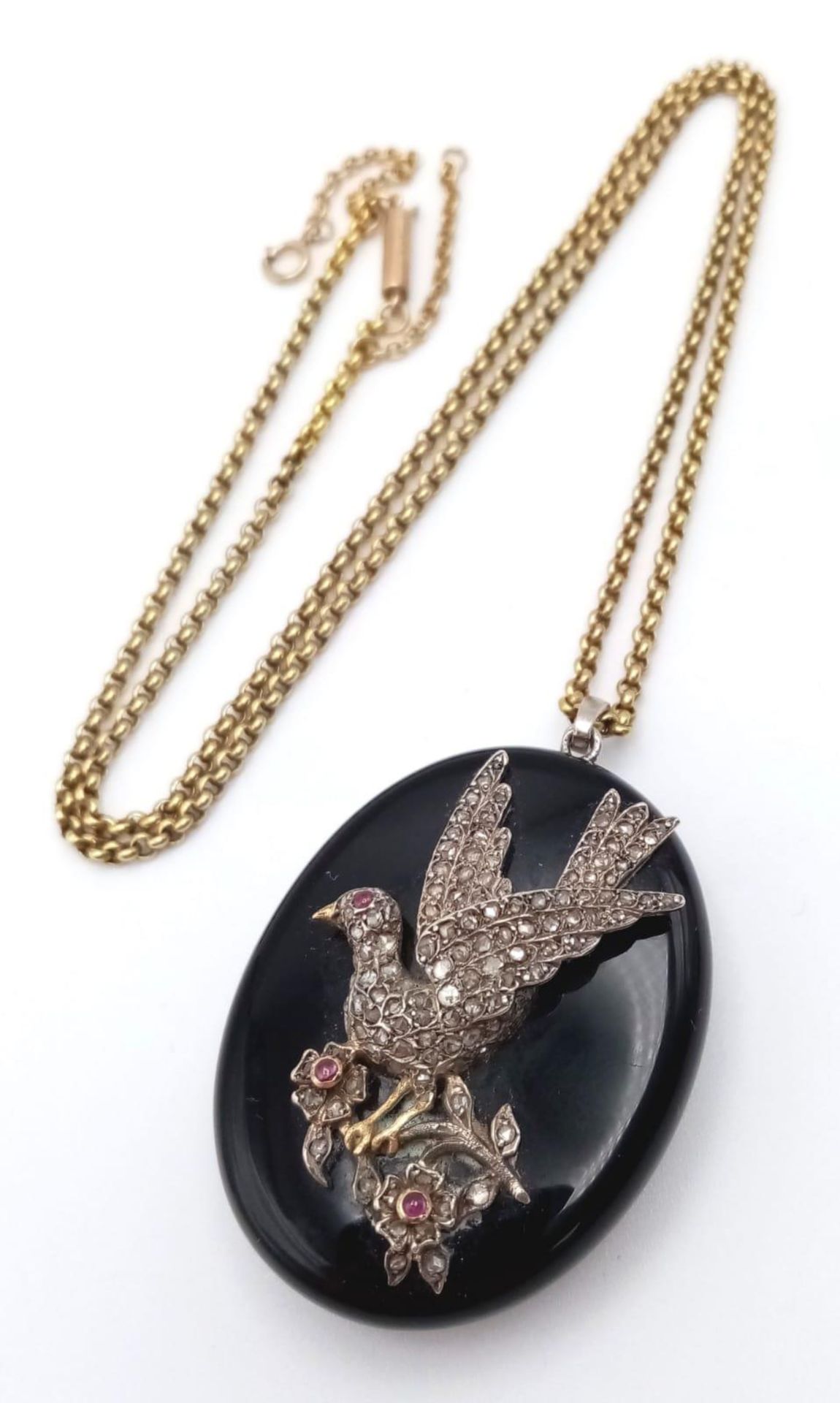 An Antique Victorian 9K Gold, Silver, Old-Cut Diamond and Ruby Decorative Dove Locket Pendant on