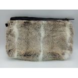 A super soft, Ceannis Faux Fur Zip Clutch Bag. Made in Sweden, this bag measures 39cm wide and feels