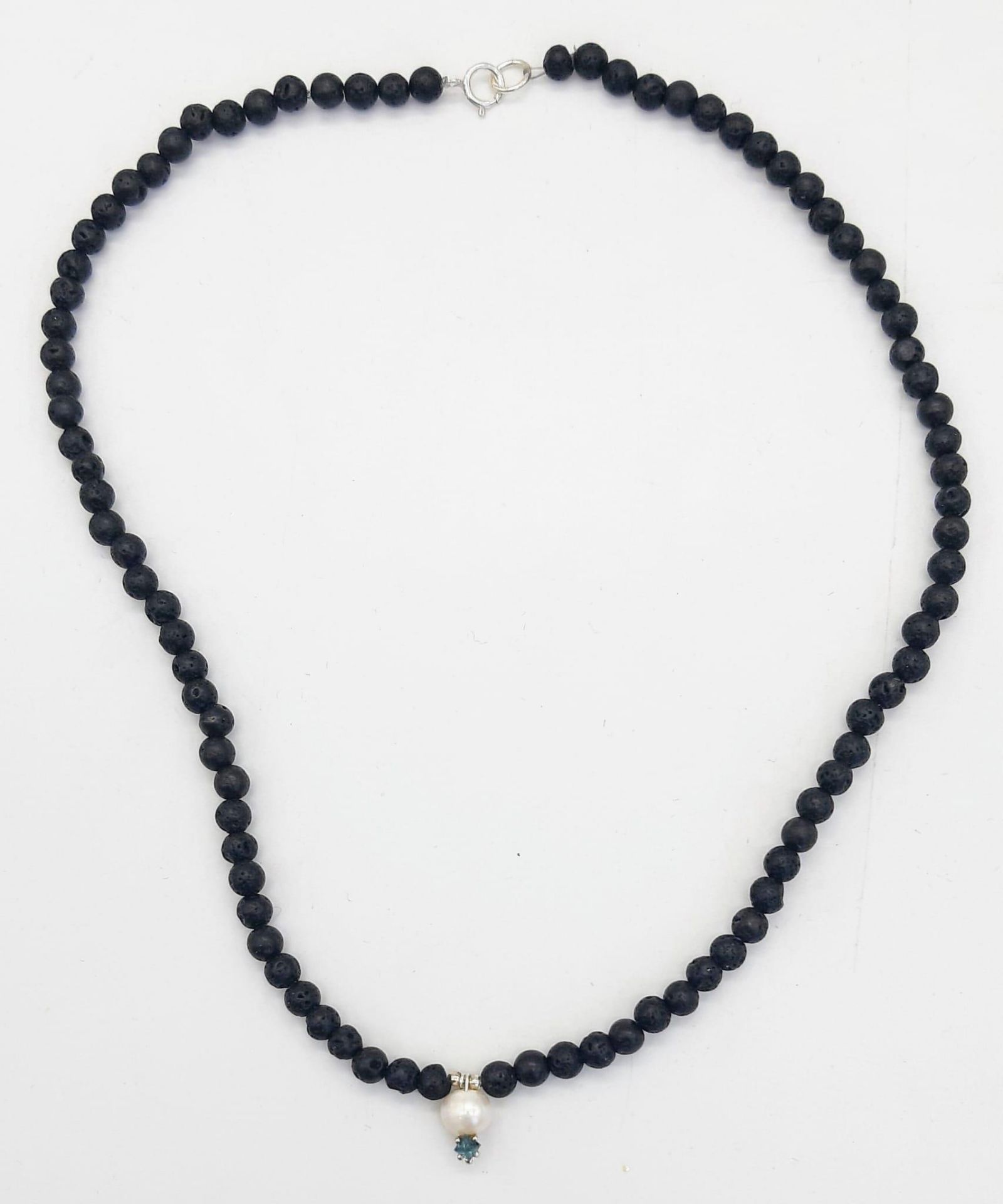 A Lava Volcanic Bead Necklace with Pearl and 0.10 Blue Diamond Pendant. 40cm.