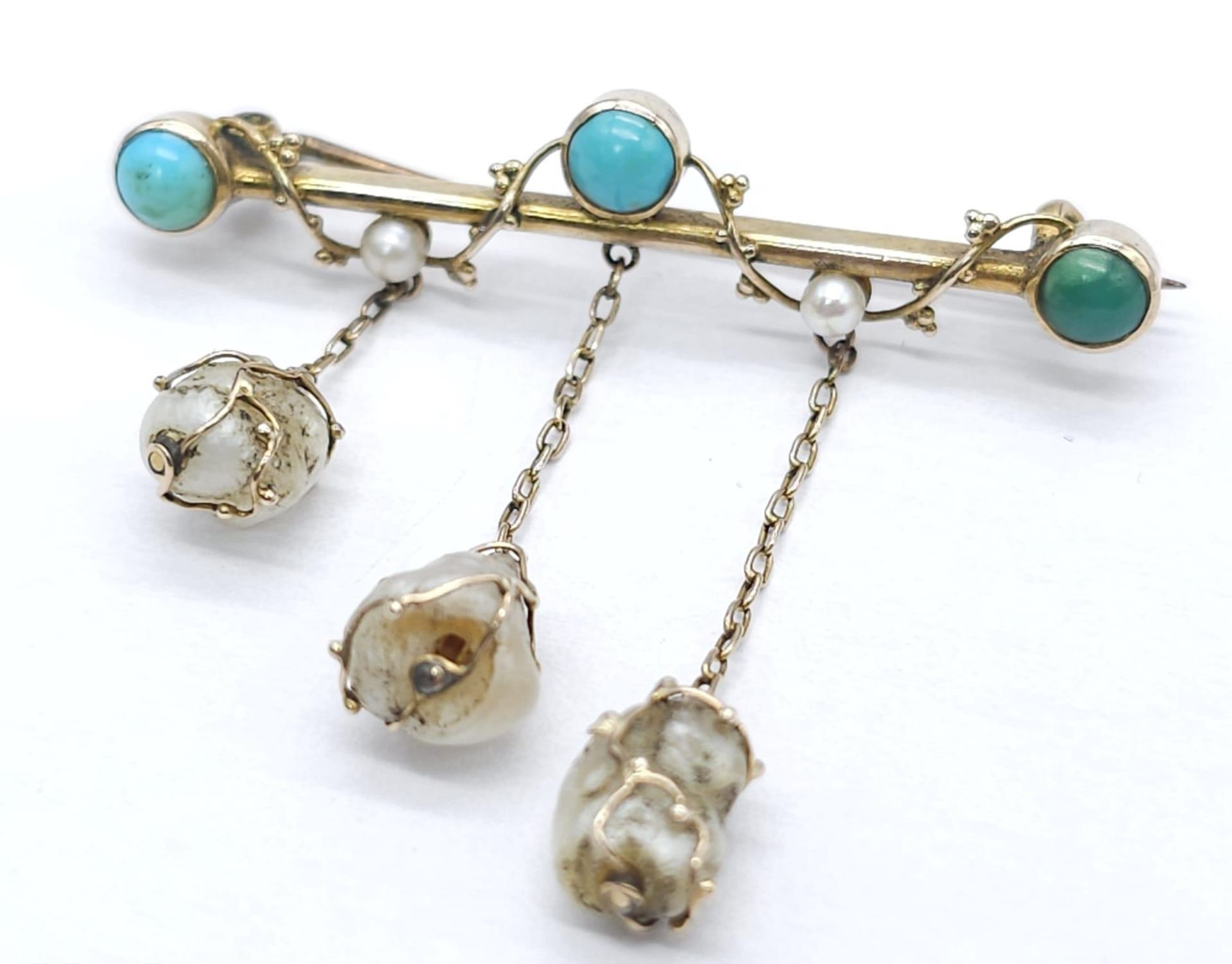 An Antique Gold, Turquoise and Pearl Bar Brooch. Three turquoise cabochons complimented with three