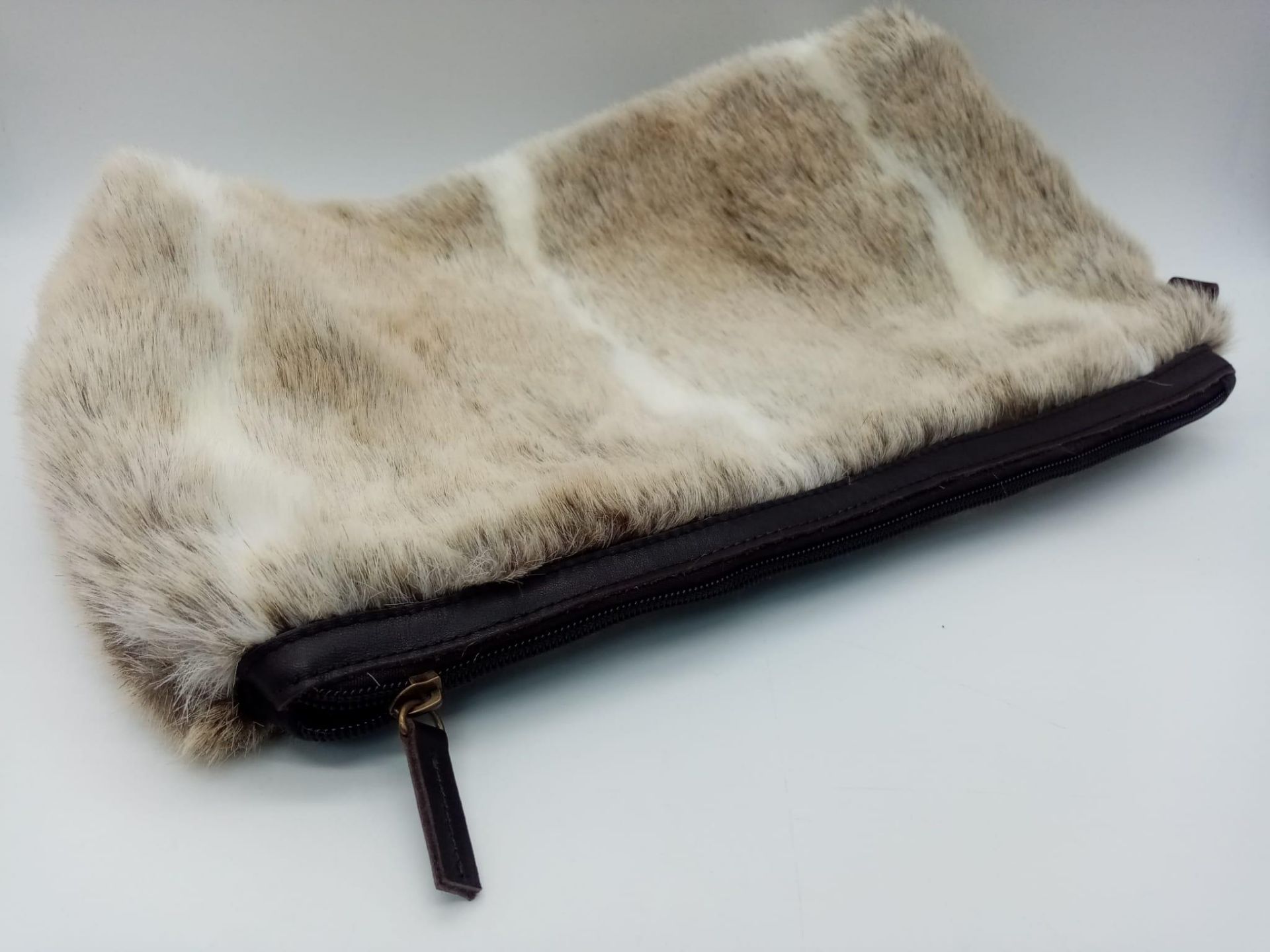 A super soft, Ceannis Faux Fur Zip Clutch Bag. Made in Sweden, this bag measures 39cm wide and feels - Image 2 of 5