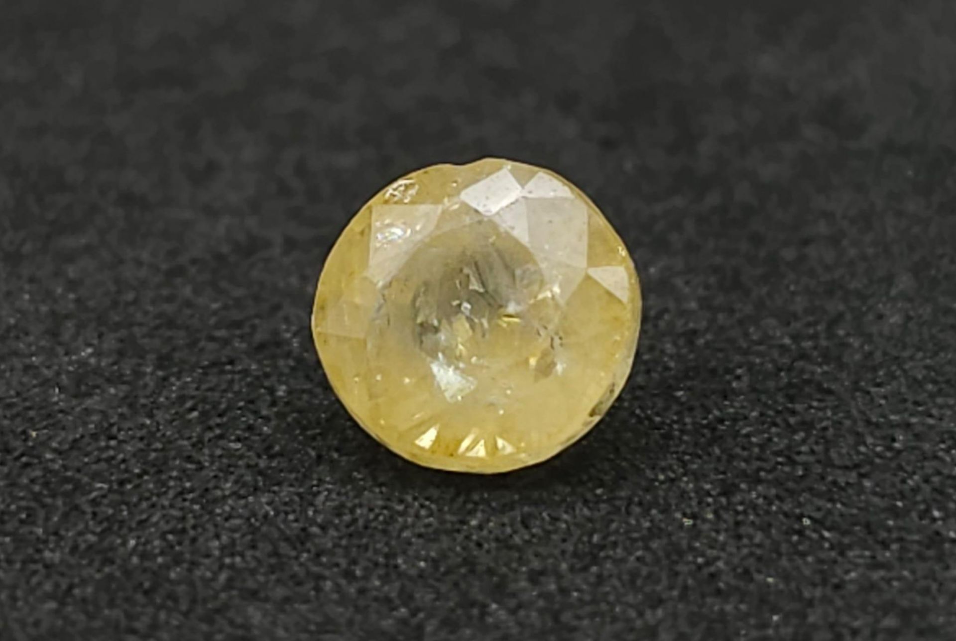 A 1.36ct Natural Madagascan Yellow Sapphire. AIG Certified.