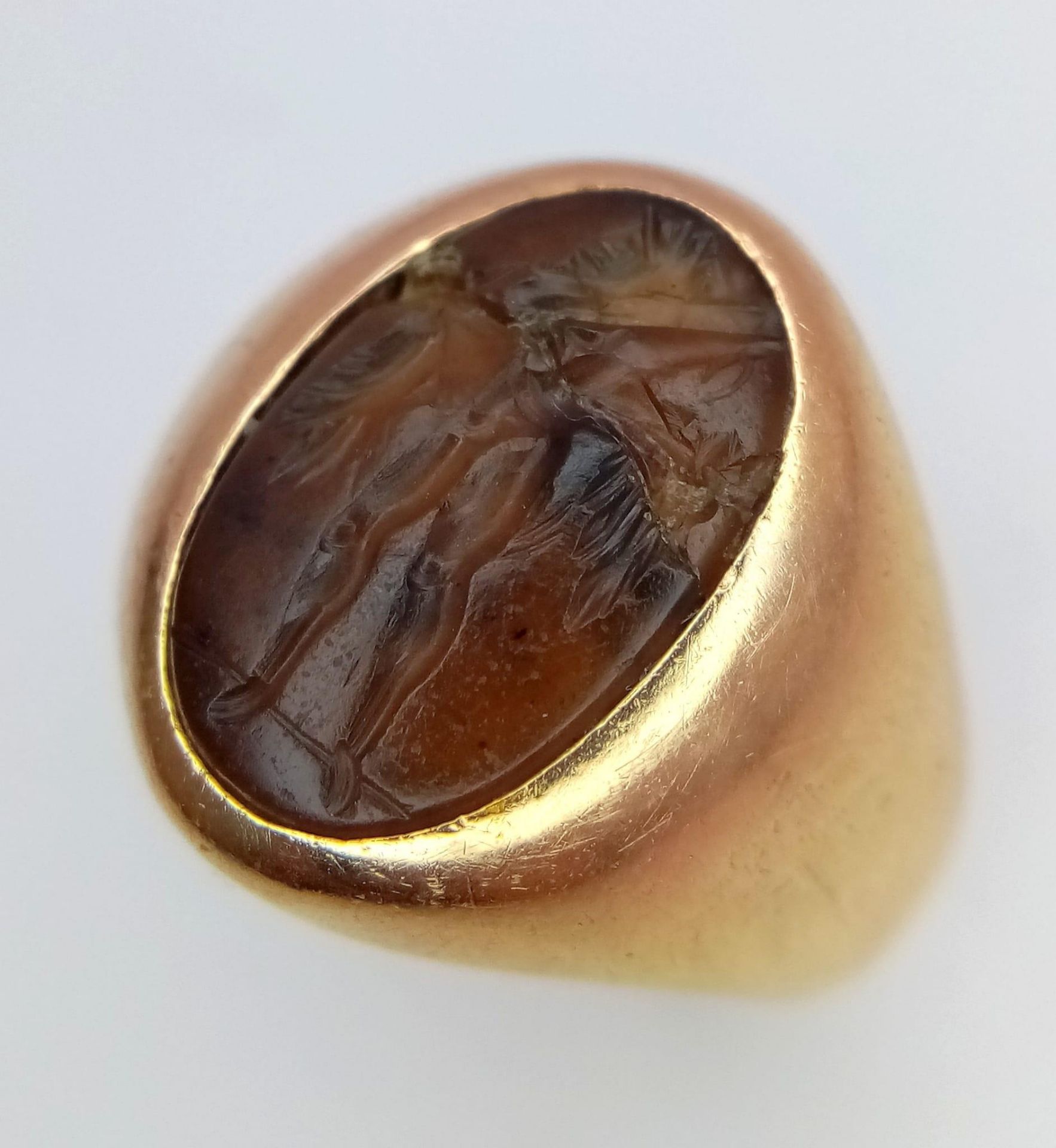 A Vintage 18K Yellow Gold Carnelian Signet Ring. A carved central stone of what appears to be an - Image 2 of 6