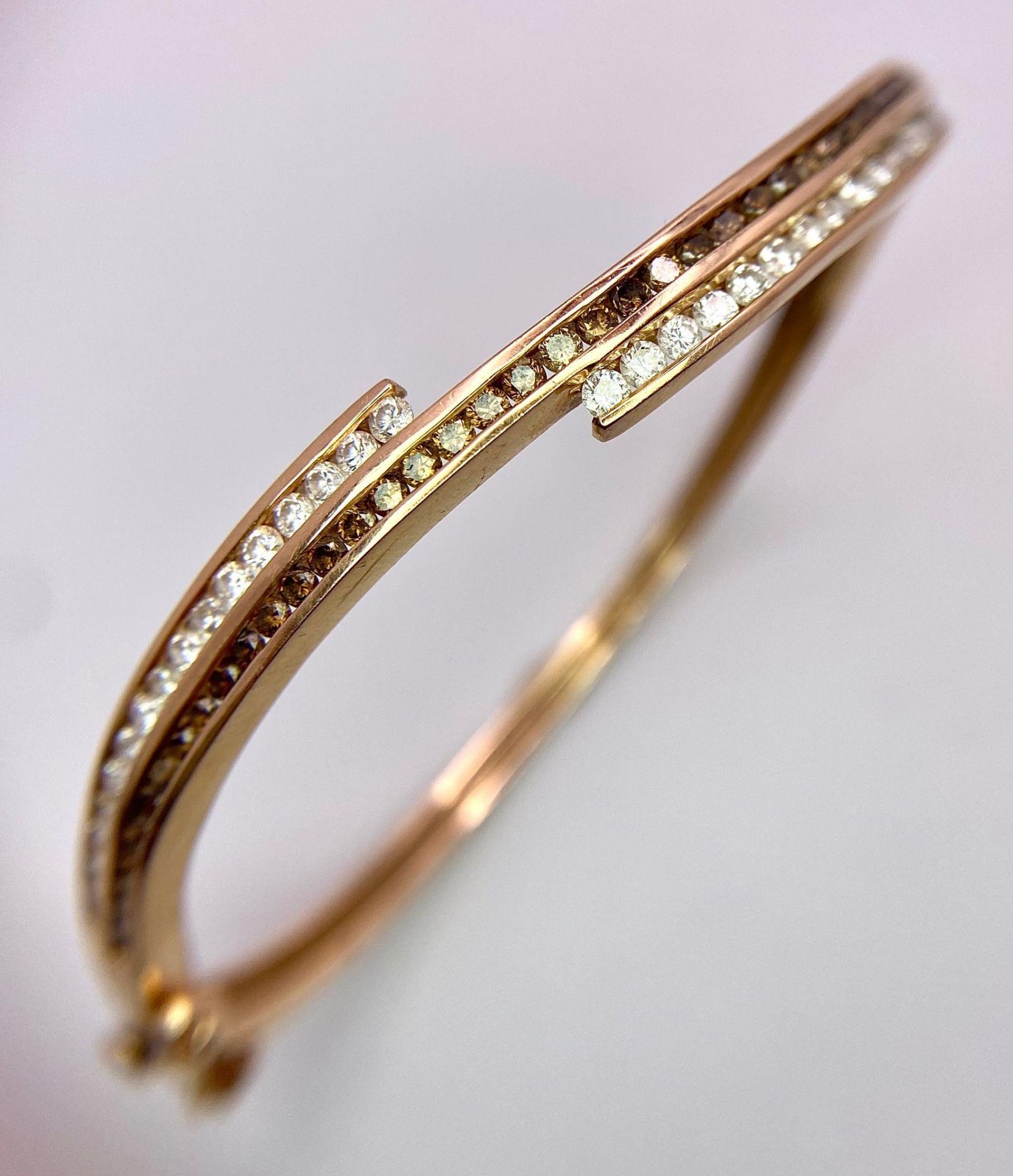 A 14K Rose Gold, White and Cognac Brown Diamond Wave Bangle. Over 60 round cut diamonds ride on a