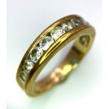 A 9K Yellow Gold and White Stone Half-Eternity Ring. Size N. 3.68g total weight.