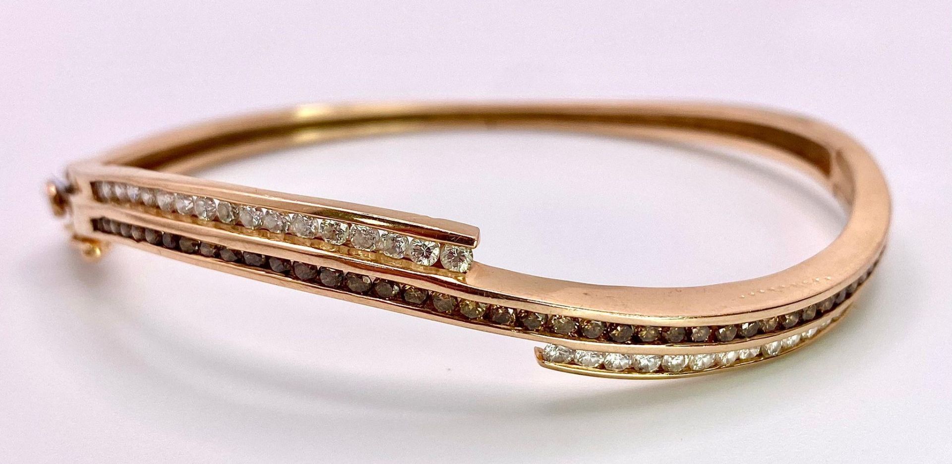 A 14K Rose Gold, White and Cognac Brown Diamond Wave Bangle. Over 60 round cut diamonds ride on a - Image 2 of 9