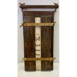 Victorian style antique trouser press wood and metal frame with white leather. Inscription on back