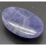 A 11.69ct Natural Cabochon Tanzanite Gemstone come with AIG Certification.