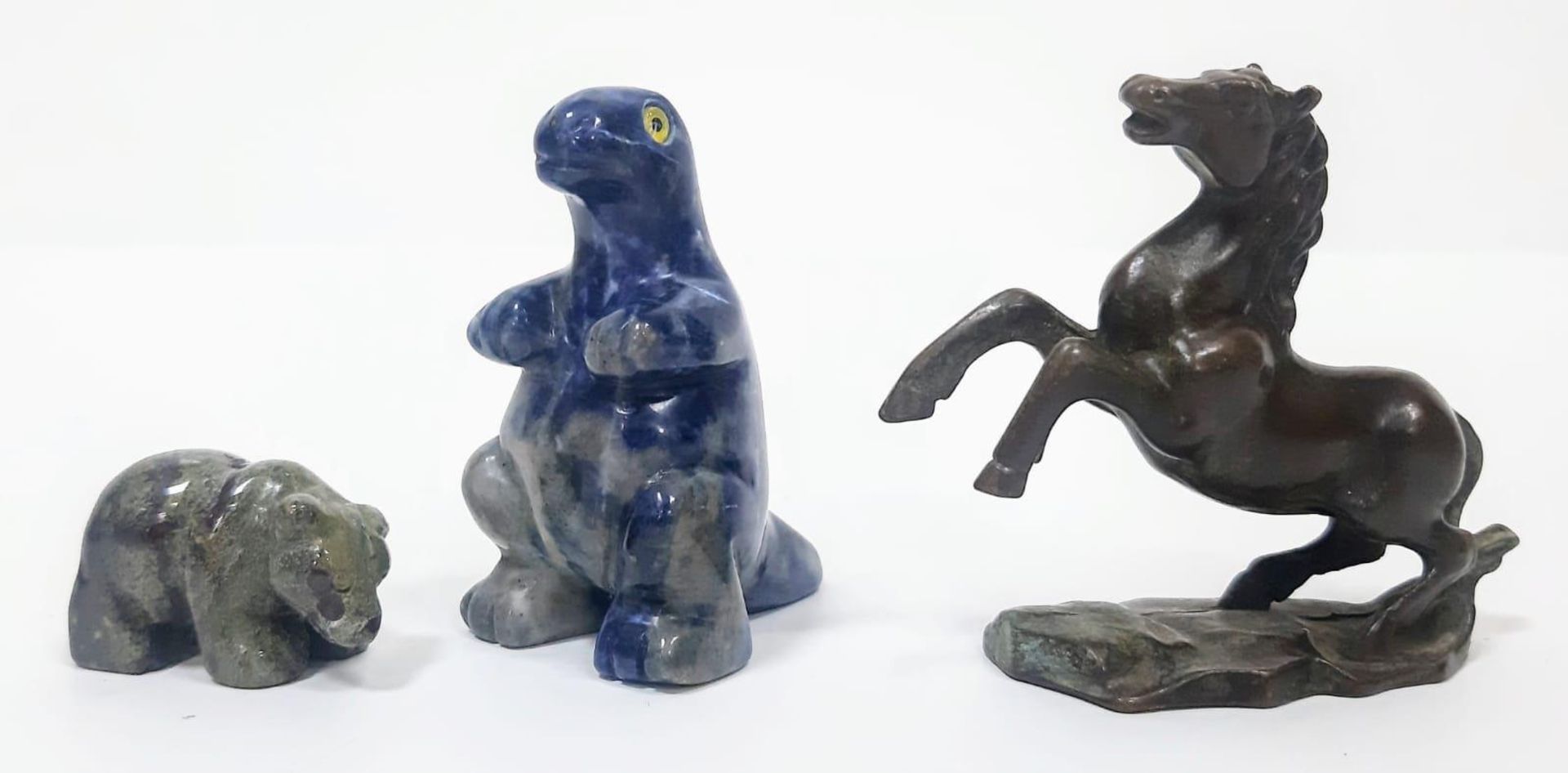 A trio of Animal Figurines. Featuring a stone Bear & standing one eyed Lizard, and a Brass Horse