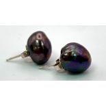 A Pair of Cultured Black Pearl Stud Earrings.