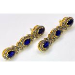 A Pair of Blue Sapphire and Diamond Drop Earrings. Set in gilded 925 Silver. Sapphire ovals - 8ctw