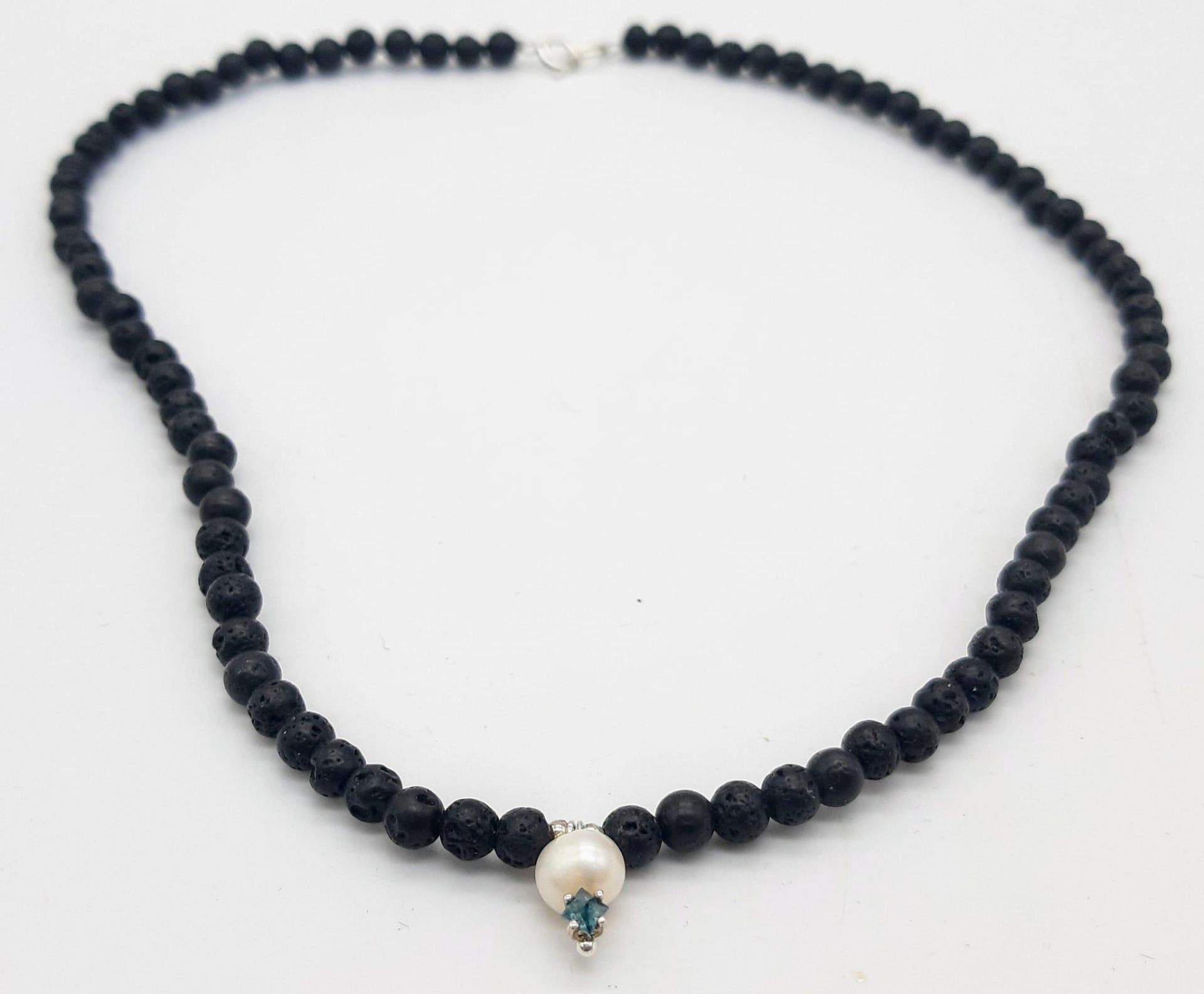 A Lava Volcanic Bead Necklace with Pearl and 0.10 Blue Diamond Pendant. 40cm. - Image 2 of 5