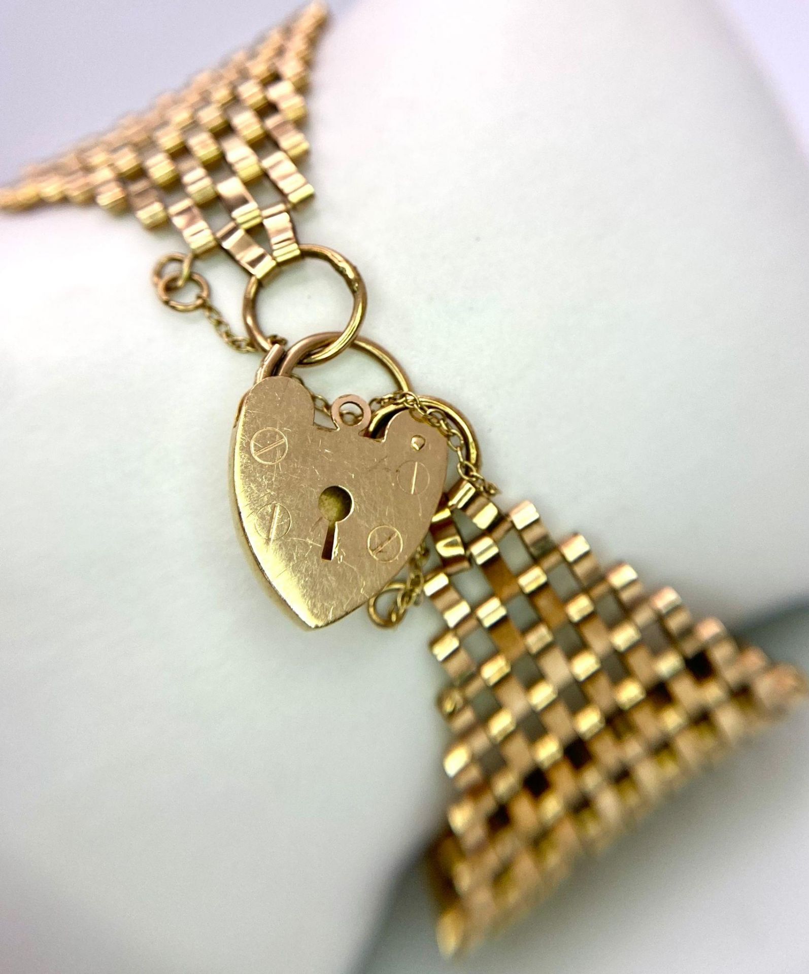 A Vintage 9K Yellow Gold Wide Gate Bracelet with Heart Clasp. 17cm. 34mm wide. 21.2g weight. - Image 2 of 5