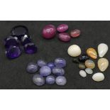 Four Gemstone Lots: 26.25ctw ruby cabochons, 11ctw Ethiopian opals, 19.6ctw tanzanite and 20.35ctw