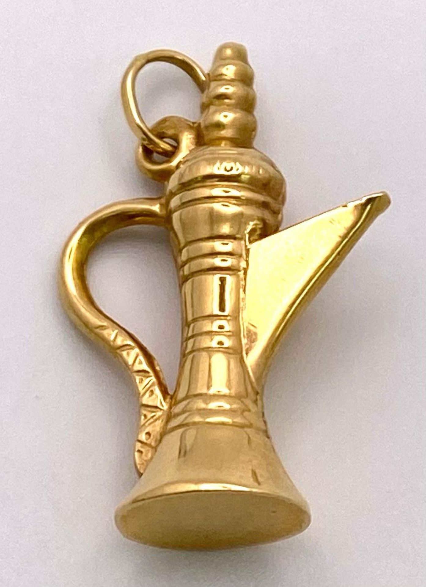 An 18K Yellow Gold Middle-Eastern Coffee Pot Pendant/Charm. 3cm. 2.7g weight.