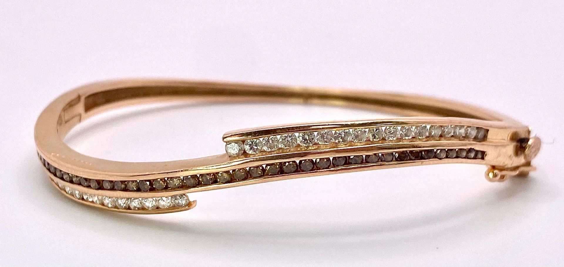 A 14K Rose Gold, White and Cognac Brown Diamond Wave Bangle. Over 60 round cut diamonds ride on a - Image 5 of 9