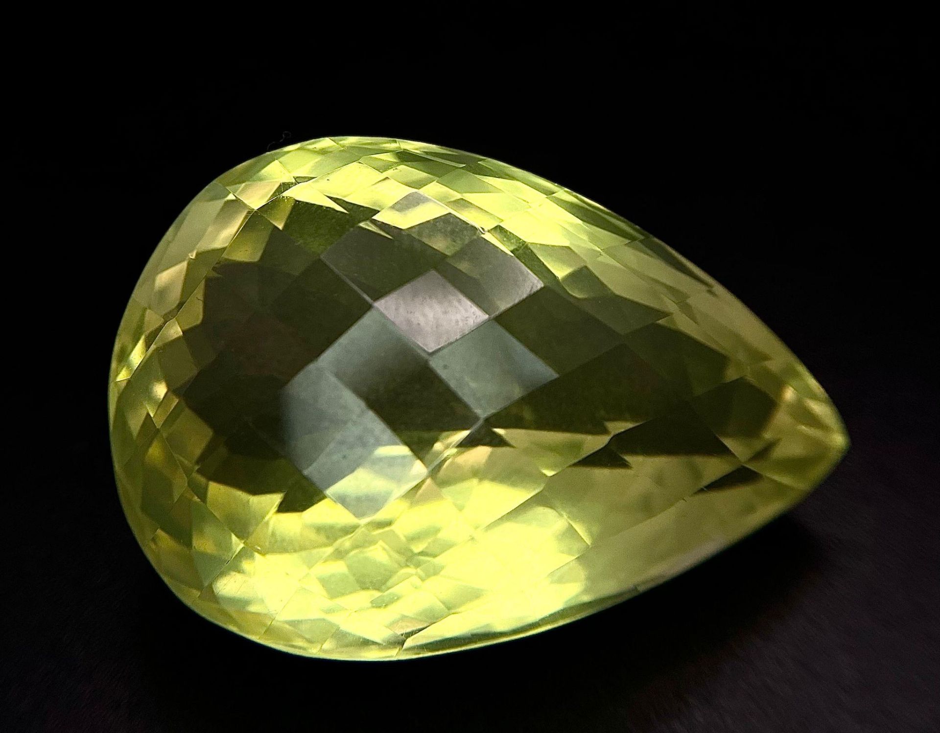 A 121.64ct Eye Clean Natural Lemon Quartz, in the Pear Checkerboard cut. Comes with the 121.64ct AIG