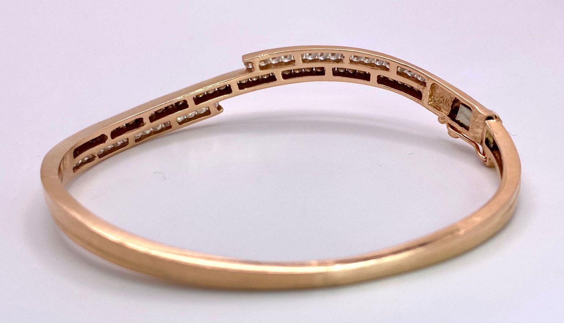 A 14K Rose Gold, White and Cognac Brown Diamond Wave Bangle. Over 60 round cut diamonds ride on a - Image 7 of 9