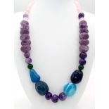 A Multi-Gemstone Graduated Necklace. Amethyst, rose quartz, jade and agate. 46cm necklace length.