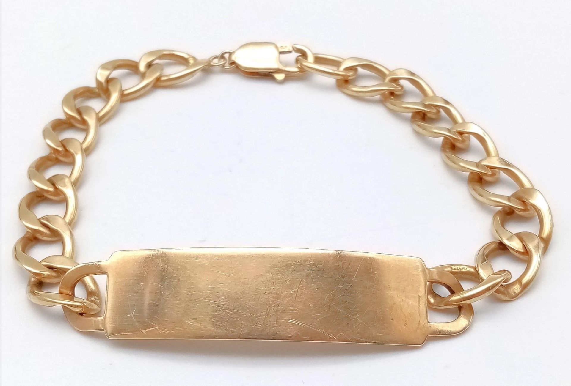 A vintage 9K Gold Curb Chain Men's ID Bracelet. Fully hallmarked, measures 22cm in length. Not