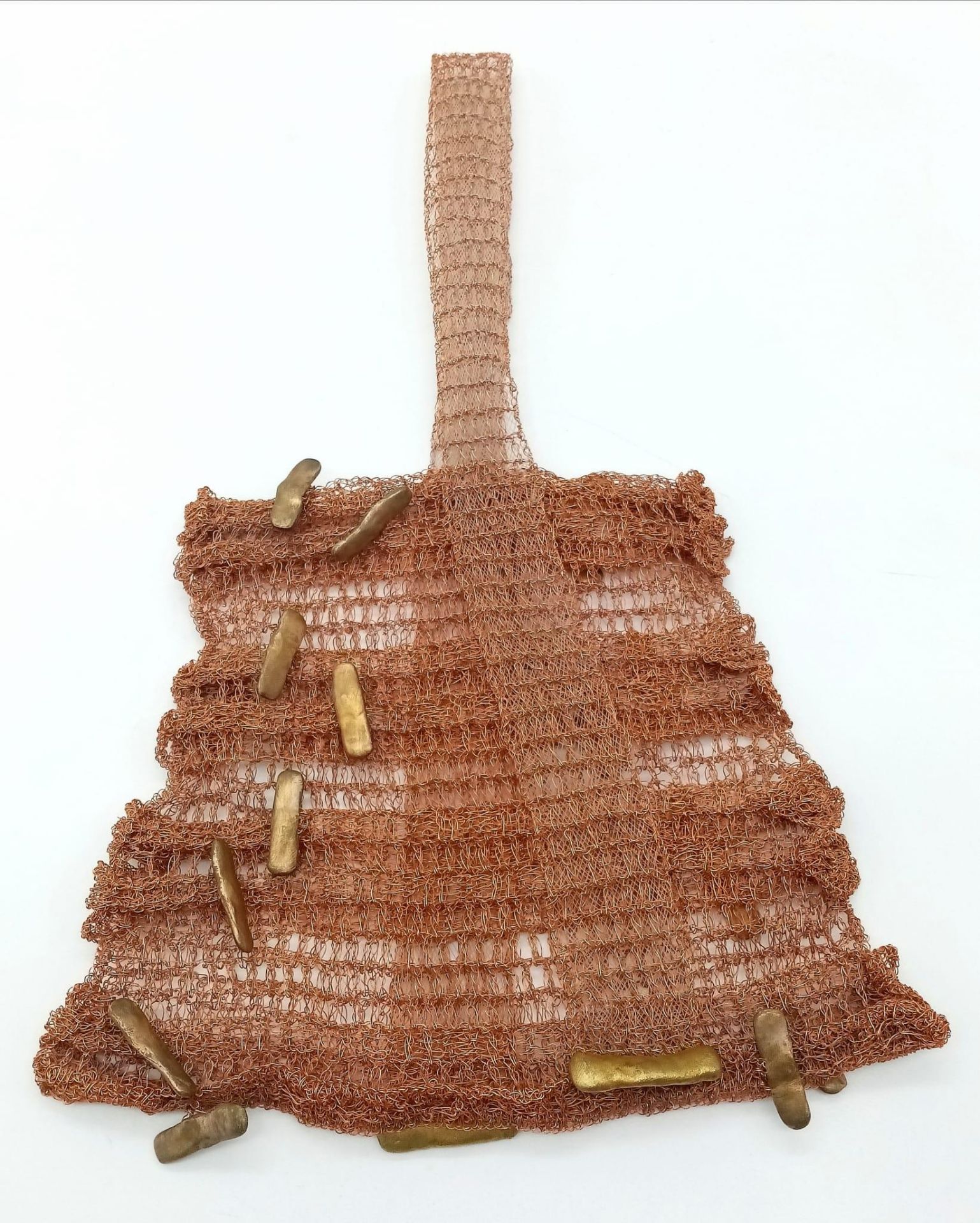 An unusual petit fashion handbag. Crafted from a copper tone wire, this bag is beautifully