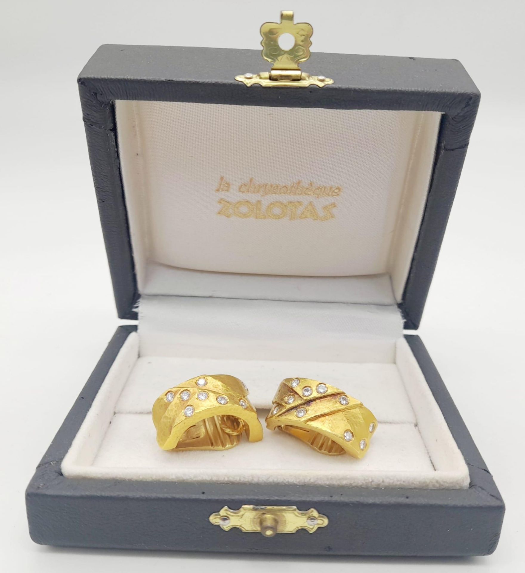 A spectacular 22 K yellow gold clip earrings with diamonds, by the renowned Greek designer