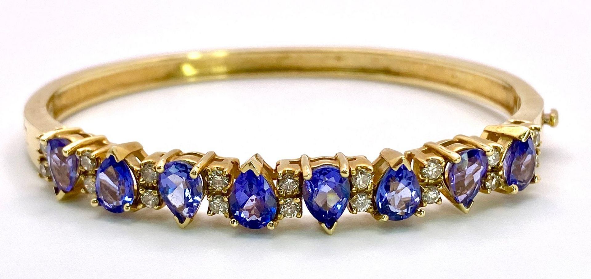 An Alluring 14K Yellow Gold, Amethyst and Diamond Bangle. High-grade, clean pear-cut amethysts - Image 4 of 10