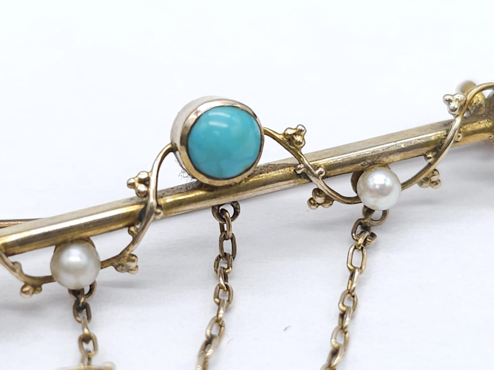 An Antique Gold, Turquoise and Pearl Bar Brooch. Three turquoise cabochons complimented with three - Image 6 of 9