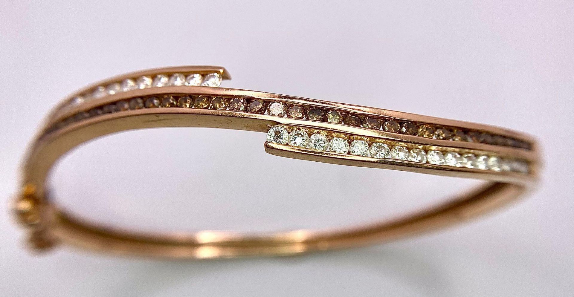 A 14K Rose Gold, White and Cognac Brown Diamond Wave Bangle. Over 60 round cut diamonds ride on a - Image 4 of 9