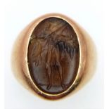 A Vintage 18K Yellow Gold Carnelian Signet Ring. A carved central stone of what appears to be an