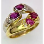 AN IMPRESSIVE 18K YELLOW AND WHITE GOLD SET WITH DIAMOND & RUBY DOUBLE BAND RING, APPROX 0.80CT TEAR
