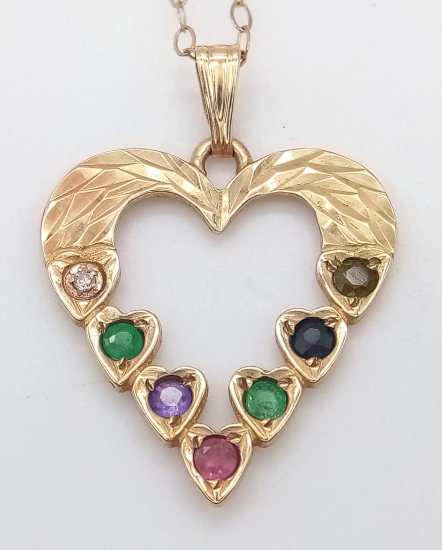 A 9K yellow gold 'DEAREST' heart necklace set with diamond, emeralds, amethyst, ruby, sapphire and - Image 3 of 5