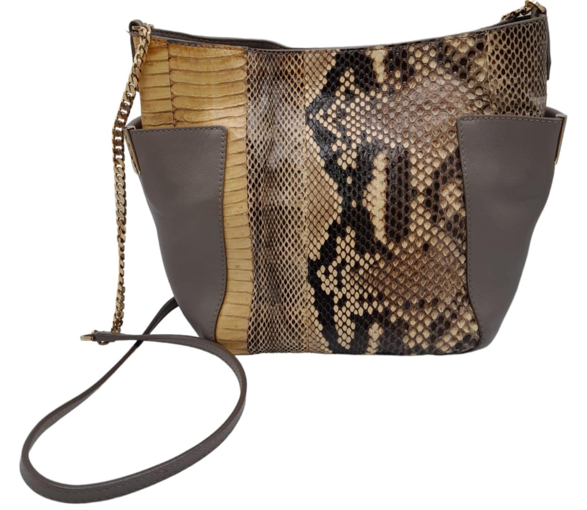 A Jimmy Choo Taupe Snakeskin Crossbody Bag. Snakeskin and leather exterior with gold-toned hardware,
