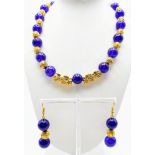 A Chinese deep lavender jade necklace and earring set with heavily gilded pixius (Mythological