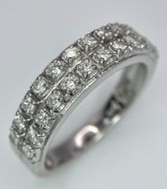 A 9K WHITE GOLD 2 ROW 0.25CT DIAMOND BAND RING. TOTAL WEIGHT 3.4G. SIZE O