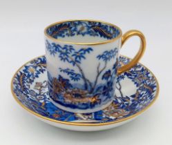 AN EARLY CHINESE BONE CHINA CUP AND SAUCER WITH ORNATE GILDED DECORATION . CIRCA 1820