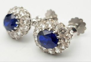 A PAIR OF STUNNING VINTAGE DIAMOND AND SAPPHIRE SCREW BACK EARRINGS SET IN 9K WHITE GOLD . 3.8gms