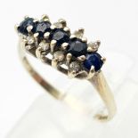 A Vintage 9K Yellow Gold Diamond and Sapphire Ring. Four sapphires and eight small diamonds. Size K.