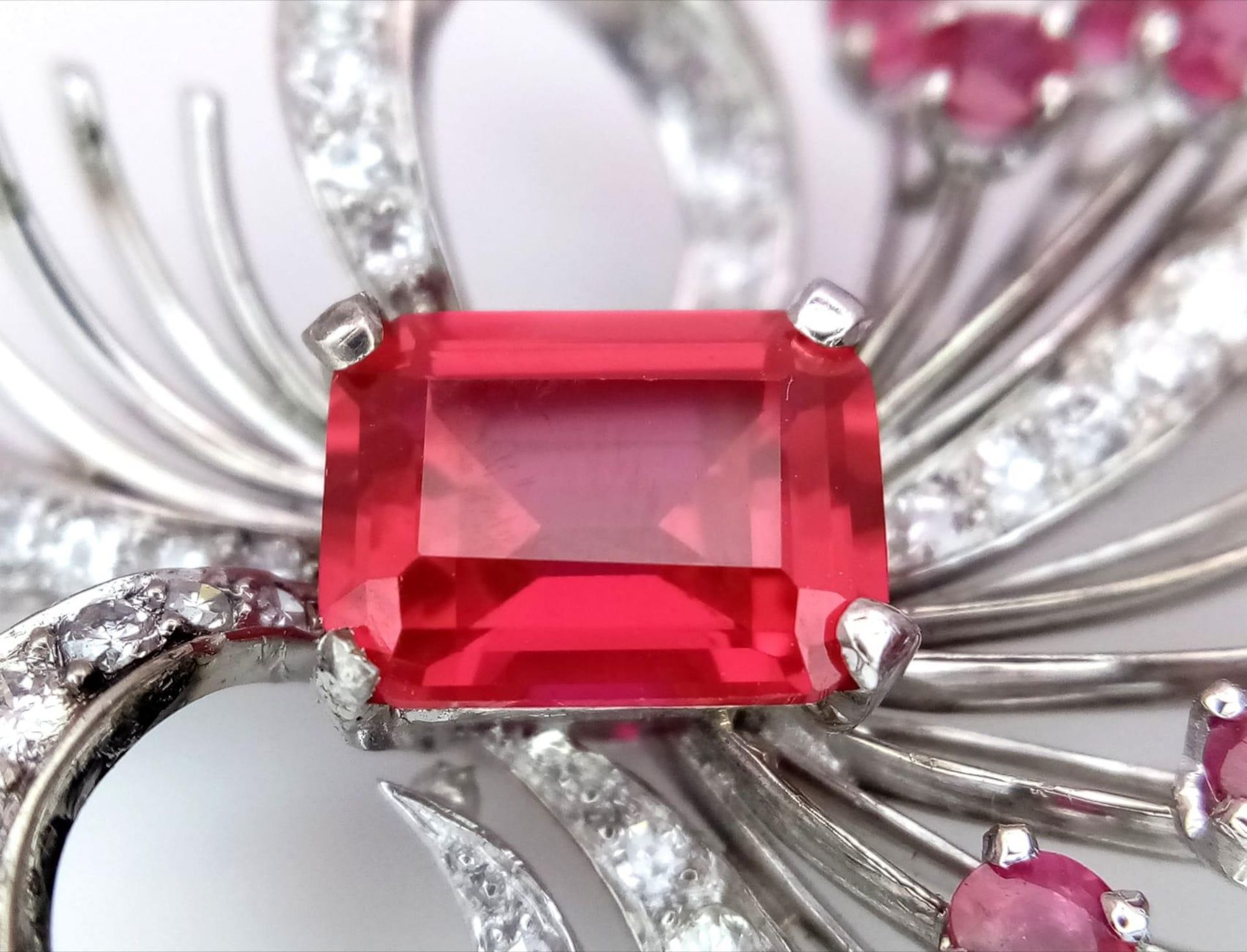 A STUNNING DIAMOND AND RUBY BROOCH SET IN PLATINUM , A MAJESTIC SPRAY OF RUBIES EMINATING FROM A - Image 4 of 7