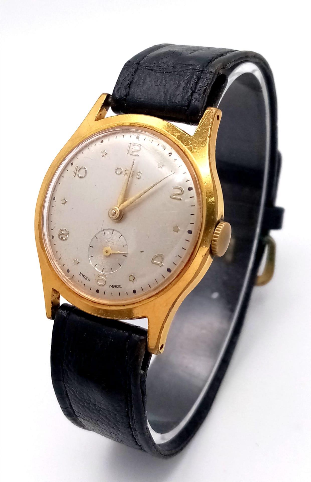 A Vintage Oris Mechanical Gents Watch. Black leather strap. Two tone case - 33mm. Silver tone dial