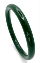 A Thin Chinese Dark Green Jade Bangle. 7mm width. 6cm inner diameter.